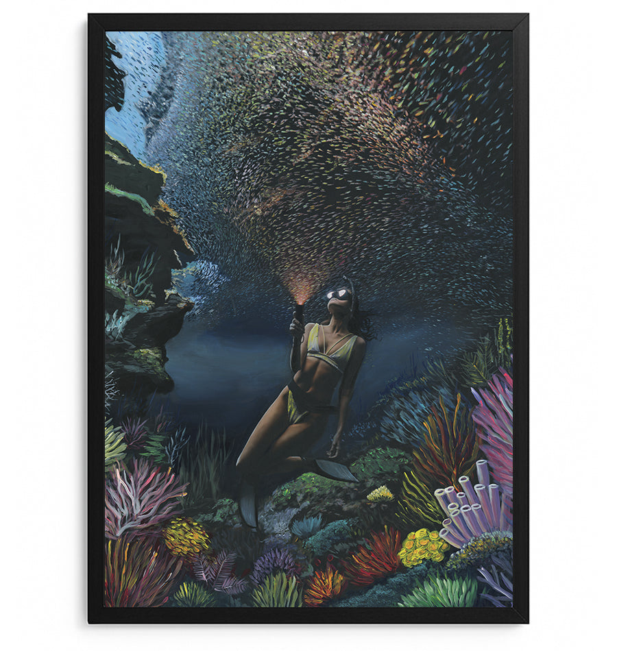 Underwater diver surrounded by coral and fish — collaboration by Carlos V. Garcia and Dan Legend, Cayman Islands.